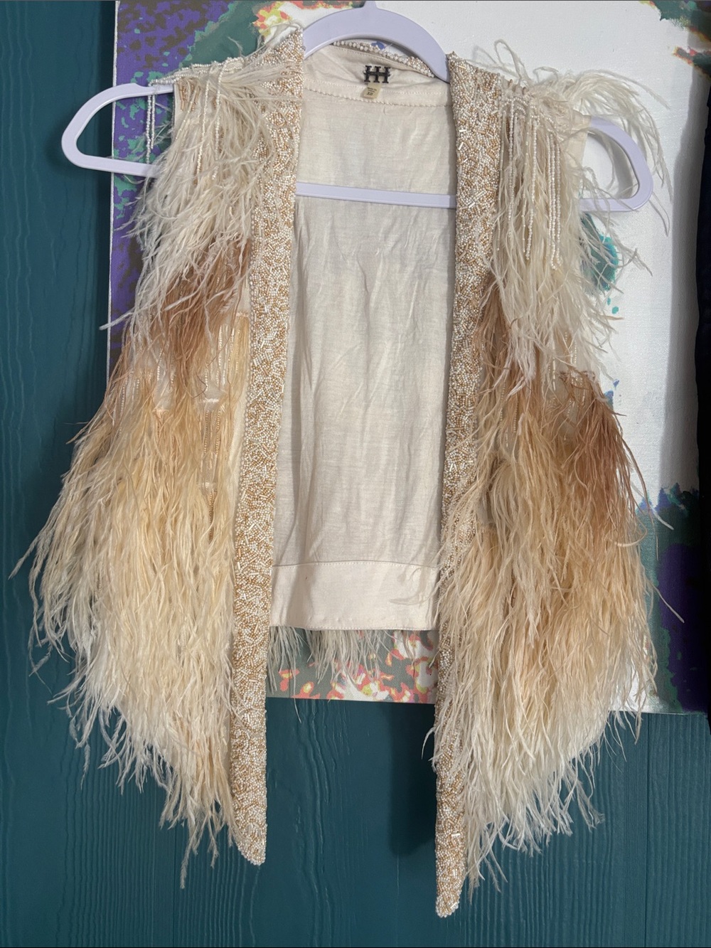 Haute Hippie Kate Open-Front Feather Vest, which originally retailed for $1,295